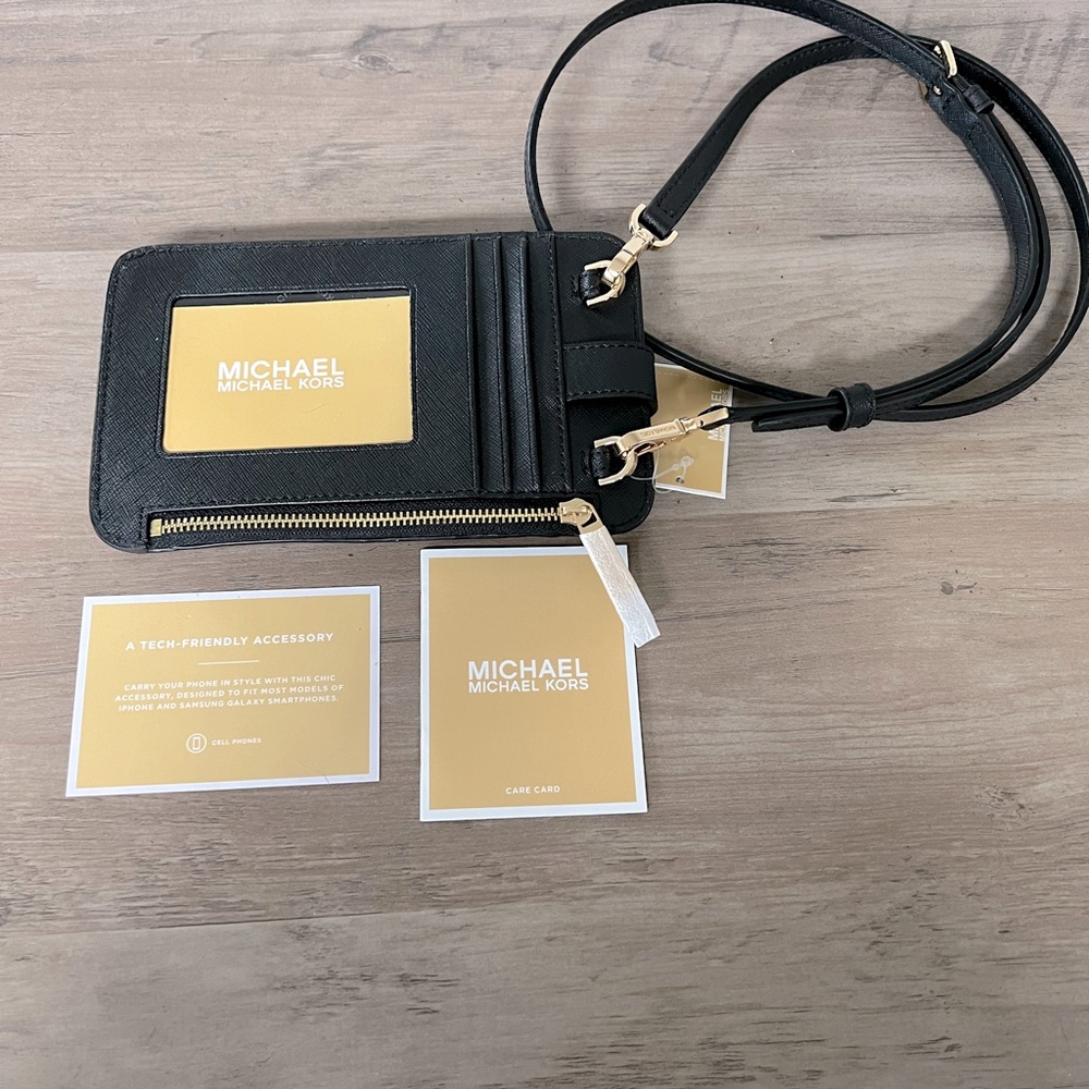 Brand new Michael Kors smart phone crossbody bag.